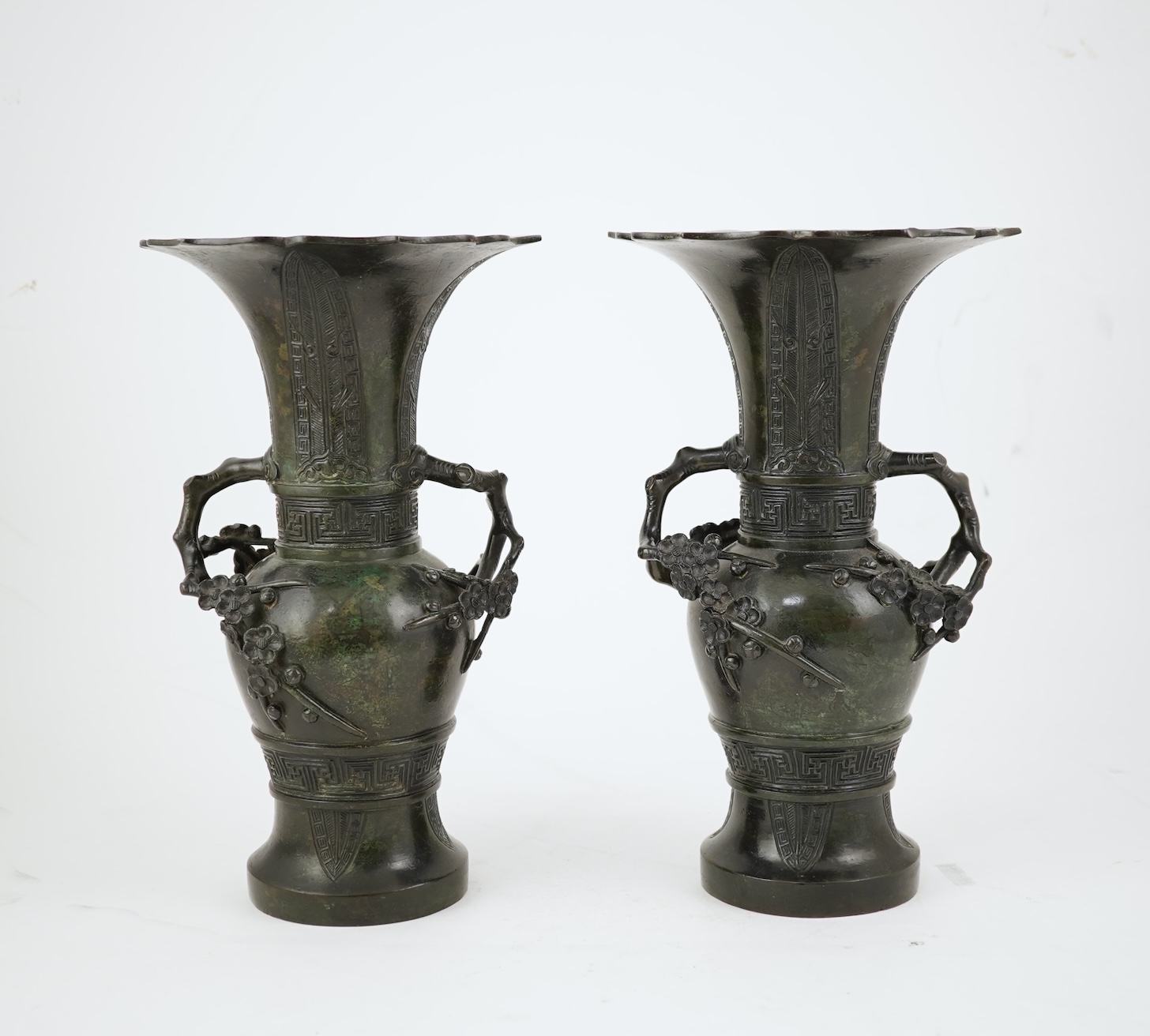 A pair of Chinese bronze gu-shaped vases, Qing dynasty